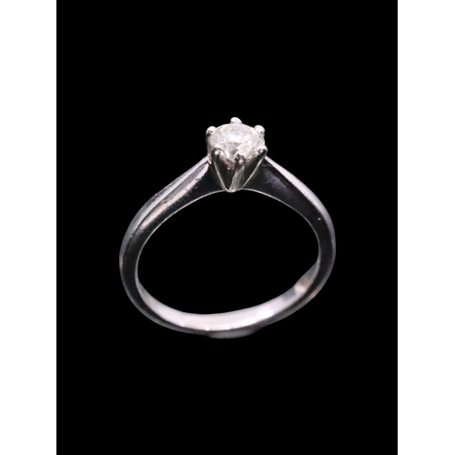 14 - A diamond solitaire ring set in platinum finger size O estimated weight of diamond 0.50cts