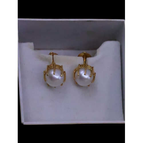 147 - A pair of pearl set earrings approx. 2.7 grams