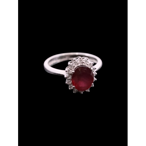 158 - An 18ct gold ruby and diamond ring, showing as finger size I