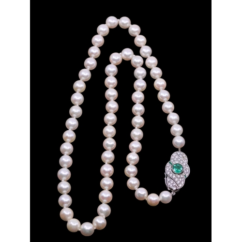 171 - A pearl necklace with diamond and emerald clasp, length approx. 18 inches