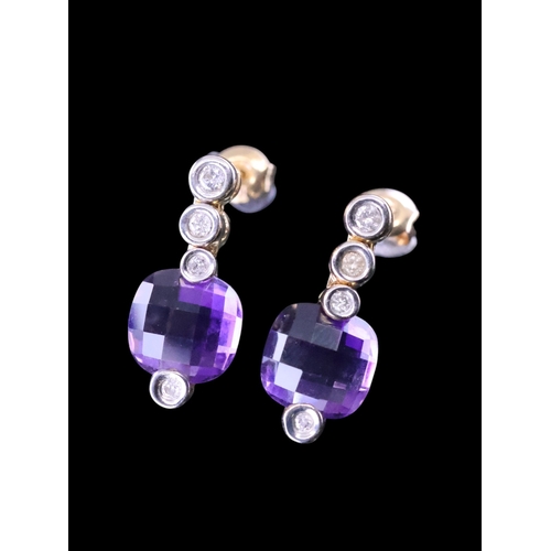 56 - An amethyst and diamond earrings approx. 4.2 grams