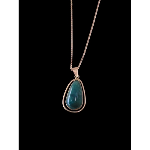 90 - A 14kt gold gem set pendant on a 9ct gold chain, total weight approx. 5.6 grams