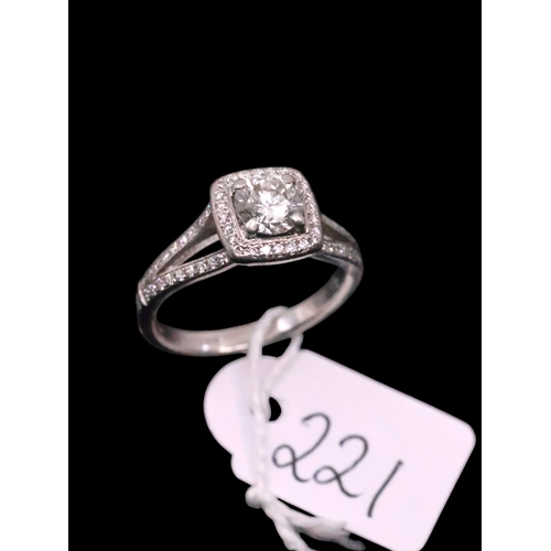 221 - A platinum diamond halo style ring finger size M retailed by Weir estimated weight of main diamond 0... 