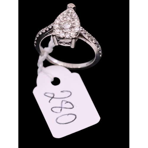 280 - An 18ct diamond halo style ring