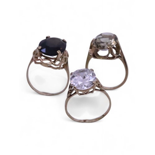 Three 9ct gold rings- 14.3g finger sizes R , V and T