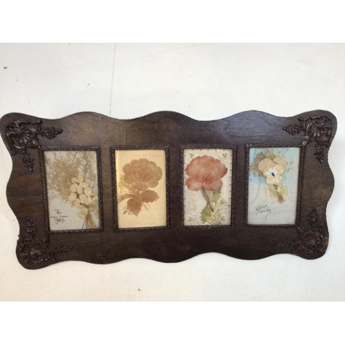33 - Victorian cards in carved oak frame depicting flowersW:49cm x H:23cm