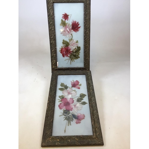 37 - A pair of glass painted panels of flowers in floral decorated gilt framesW:32cm x H:56cm