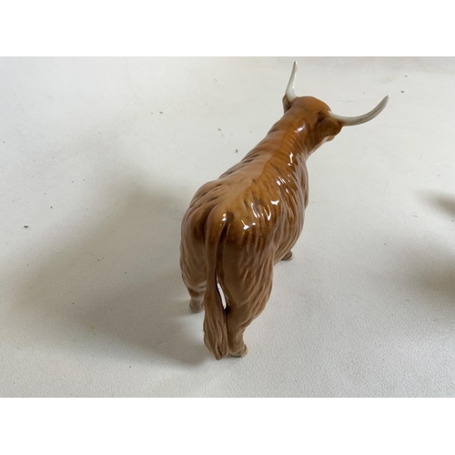 56 - Beswick Highland cattle. A Bull and a Cow with horns also with a calf. In gloss finish. Bull and cow... 