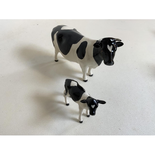 58 - Beswick Champion Claybury Leegwater Friesian cow with calf - marked to underbelly. Both with heart s... 
