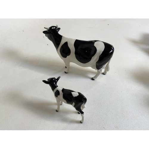 58 - Beswick Champion Claybury Leegwater Friesian cow with calf - marked to underbelly. Both with heart s... 