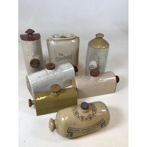 A collection of stoneware foot warmers including The Osolokosi and a