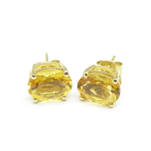 1062 - A pair of 9ct gold and citrine earrings, 2.2g