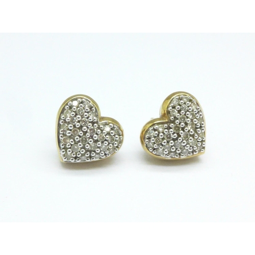 1064 - A pair of 9ct gold and diamond earrings, 4.5g