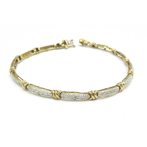 1065 - A 9ct gold and diamond bracelet, 6.5g