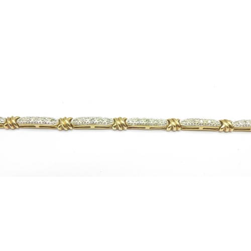 1065 - A 9ct gold and diamond bracelet, 6.5g