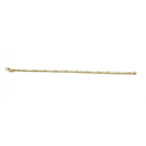 1065 - A 9ct gold and diamond bracelet, 6.5g