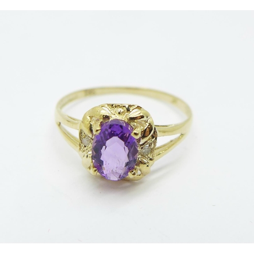 1068 - A 9ct gold, amethyst and diamond ring, 1.1, O