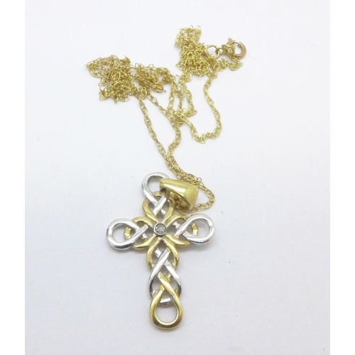 1071 - A 9ct gold and diamond cross pendant on a 9ct gold chain, 2g