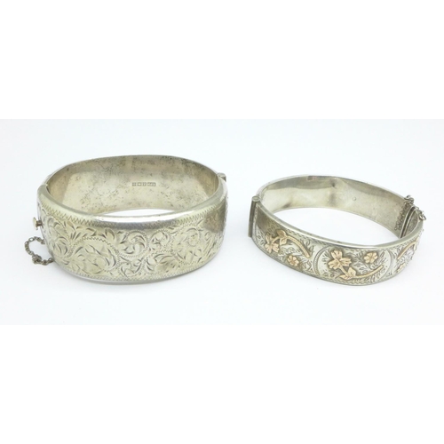 1078 - Two silver bangles, one with gold applied decoration, both a/f (dents), 63g