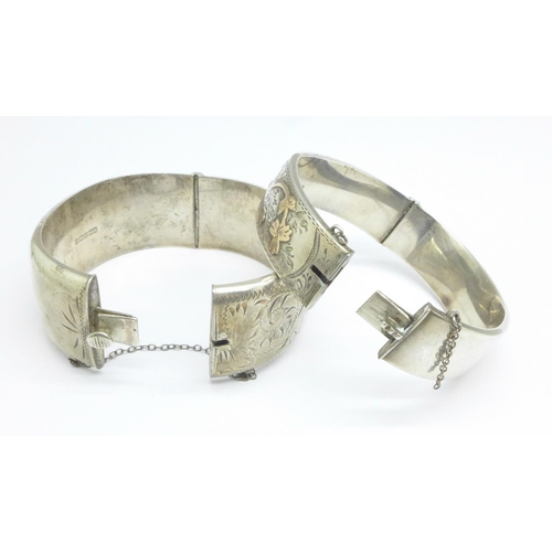 1078 - Two silver bangles, one with gold applied decoration, both a/f (dents), 63g