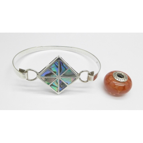 1080 - A silver bangle set with abalone and a Pandora charm