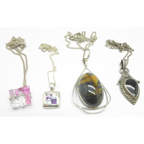 1083 - Four silver pendants and chains