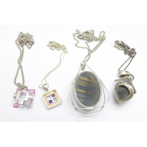 1083 - Four silver pendants and chains