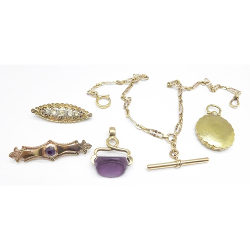 1085 - A plated Albert chain, two brooches, a fob and a photograph locket