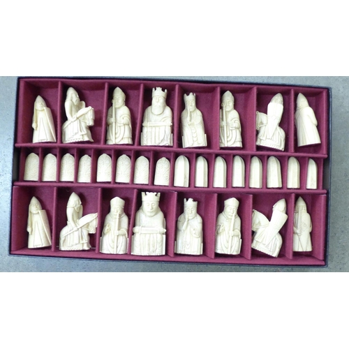 1099 - A set of resin chess pieces, boxed**PLEASE NOTE THIS LOT IS NOT ELIGIBLE FOR POSTING AND PACKING**