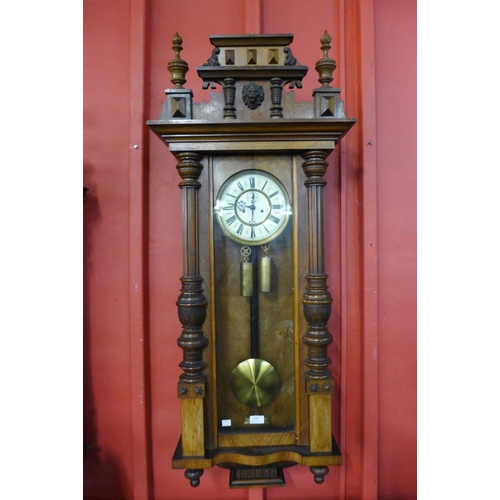 100 - A 19th Century walnut Vienna double weight wall clock