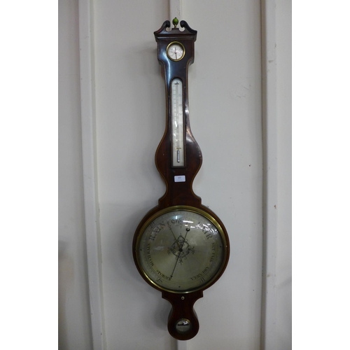 102 - A 19th Century inlaid mahogany wheel barometer, signed W. Adomossi, Manchester