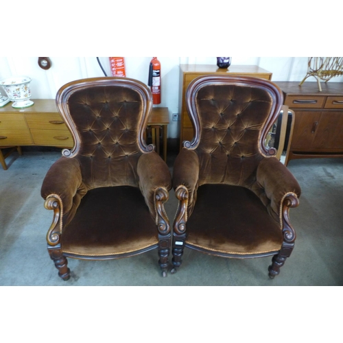 104 - A pair of Victorian mahogany and upholstered spoonback armchairs