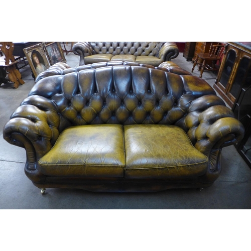 105 - A Chesterfield brown leather settee