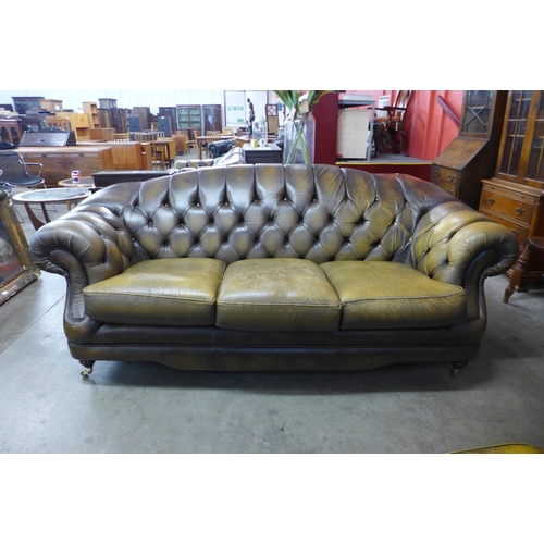 107 - A Chesterfield brown leather settee