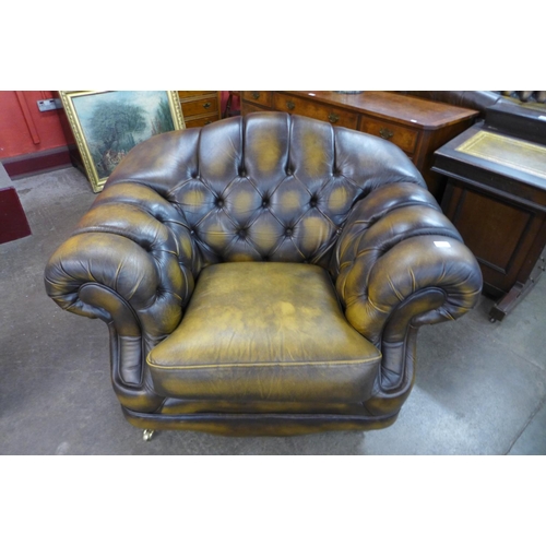 108 - A Chesterfield brown leather armchair