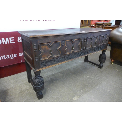 111 - A 17 Century style carved oak dresser