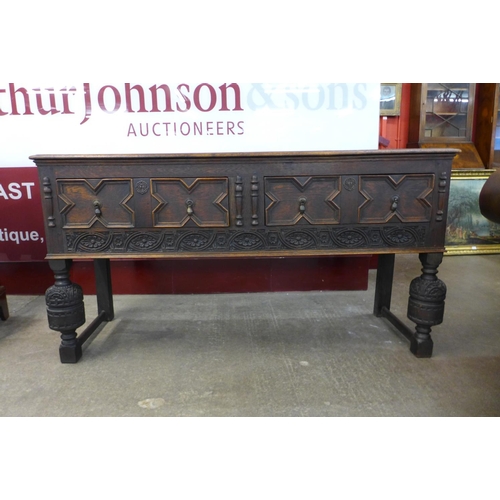 111 - A 17 Century style carved oak dresser