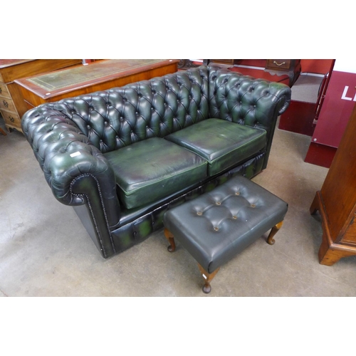 115 - A Chesterfield green leather settee and a foot stool