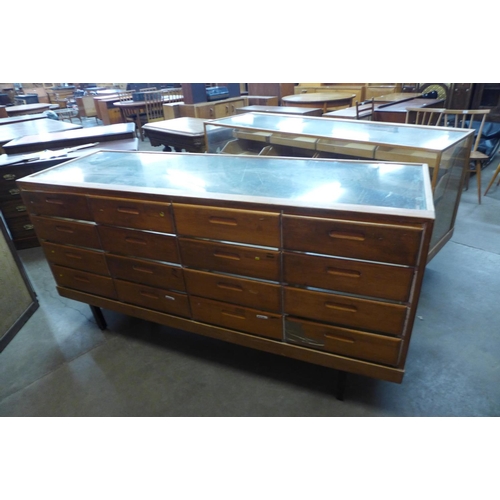 121 - A pair of mid 20th Century oak haberdashery shop cabinets