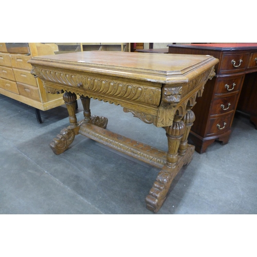 123 - A Victorian Jacobean Revival carved oak single drawer centre table