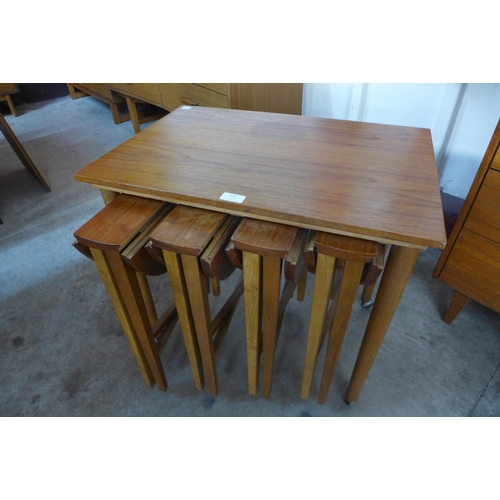 128 - A teak nest of tables