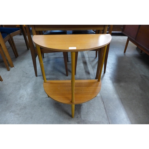 136 - A teak demi-lune side table