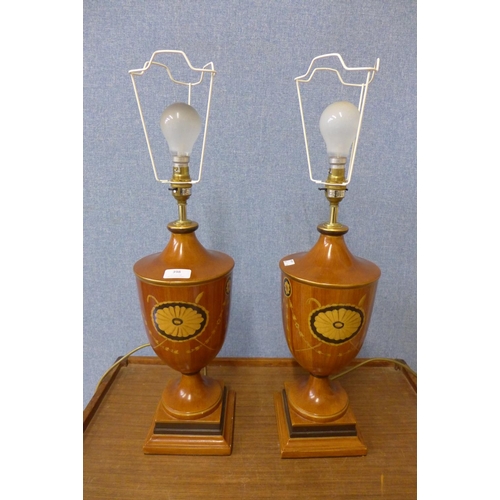 398 - A pair of Sheraton style painted mahogany table lamps