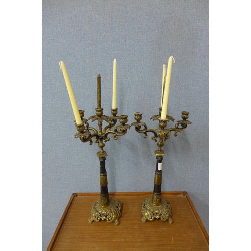 399 - A pair of gilt metal candelabra