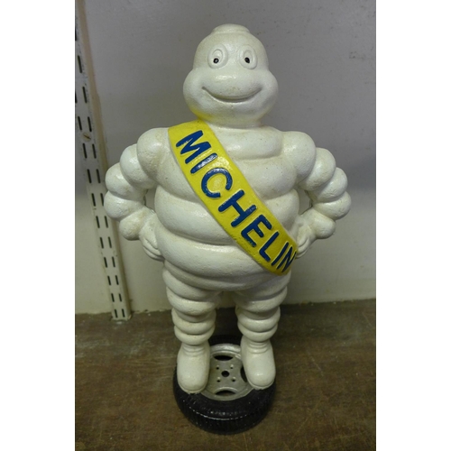 402 - A reproduction cast iron Michelin man advertising figure