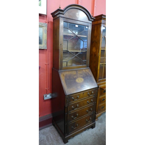 94 - A George III style inlaid mahogany bureau bookcase