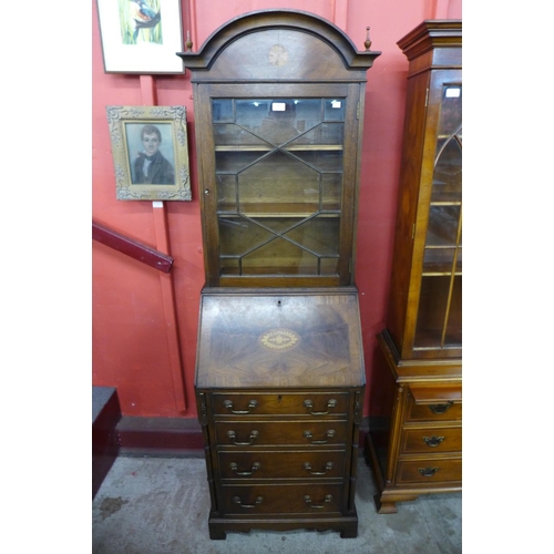 94 - A George III style inlaid mahogany bureau bookcase