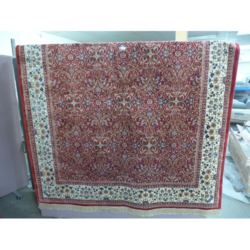 1410 - A red ground Kashmir style carpet - all over floral pattern with cream border - 3m x 2m