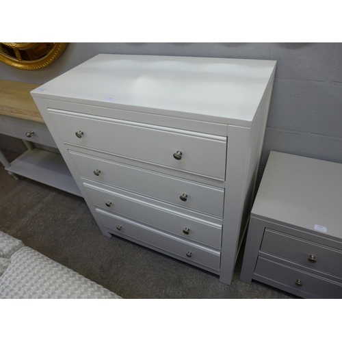 1429 - A cream painted chest of drawers