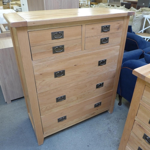 1388 - A large oak chest of five drawers